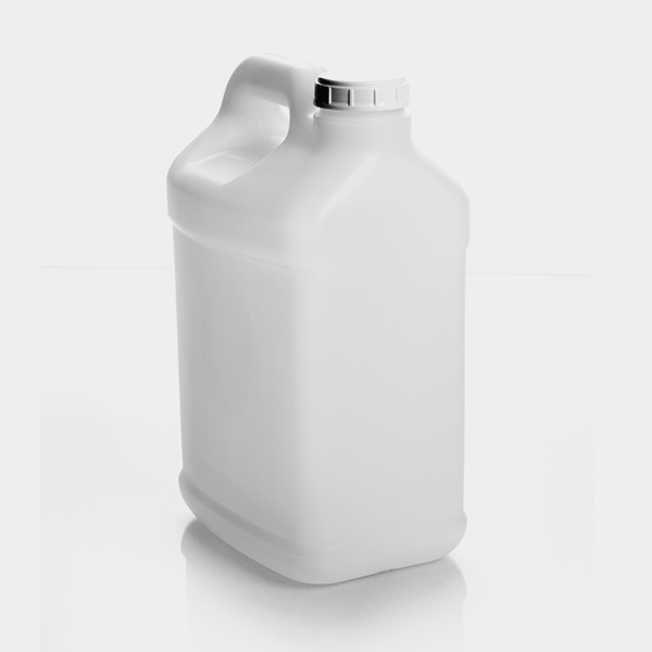 a gallon of white liquid on a white surface.