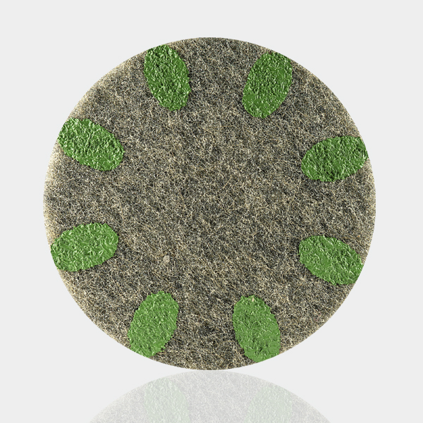 a round piece of grass with green leaves on it.