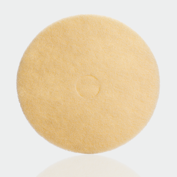 a yellow sponge on a white surface.