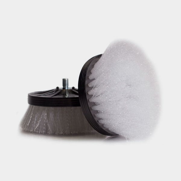 A close up of an ORBOT Micro Gray Brush on a white background.